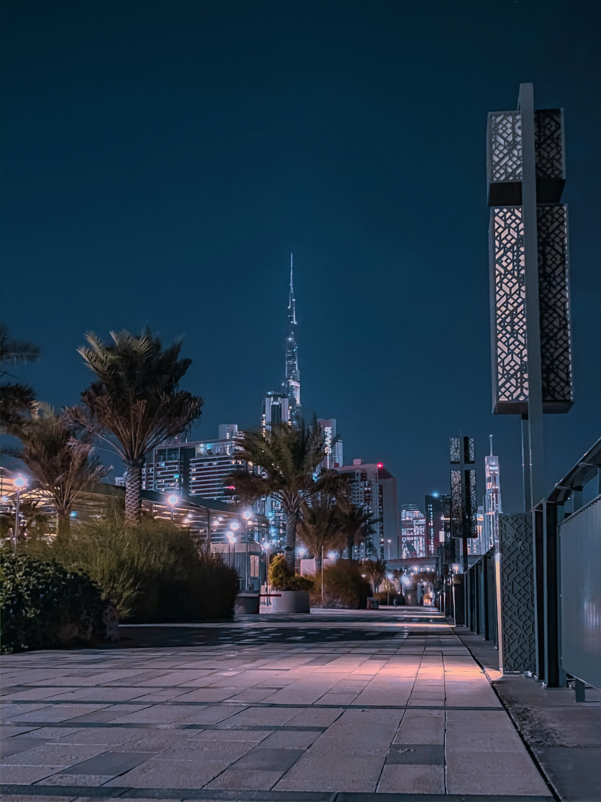 city buildings with lights turned on during night time
