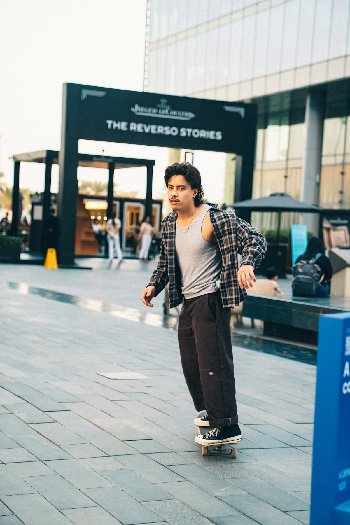 Young man skateboarding in an urban outdoor setting.