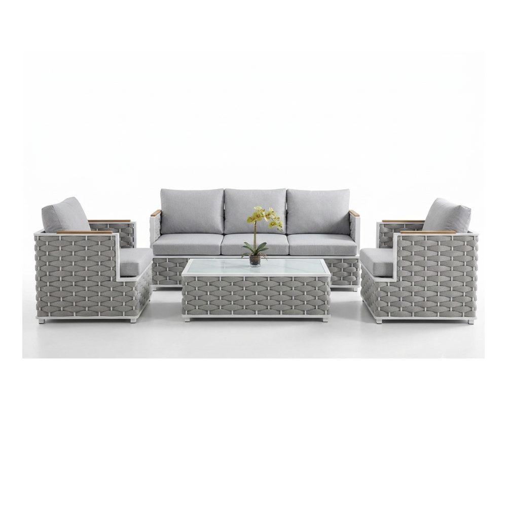 Grey wicker outdoor patio furniture set with sofa, armchairs, and glass coffee table at The Outdoor Furniture Market