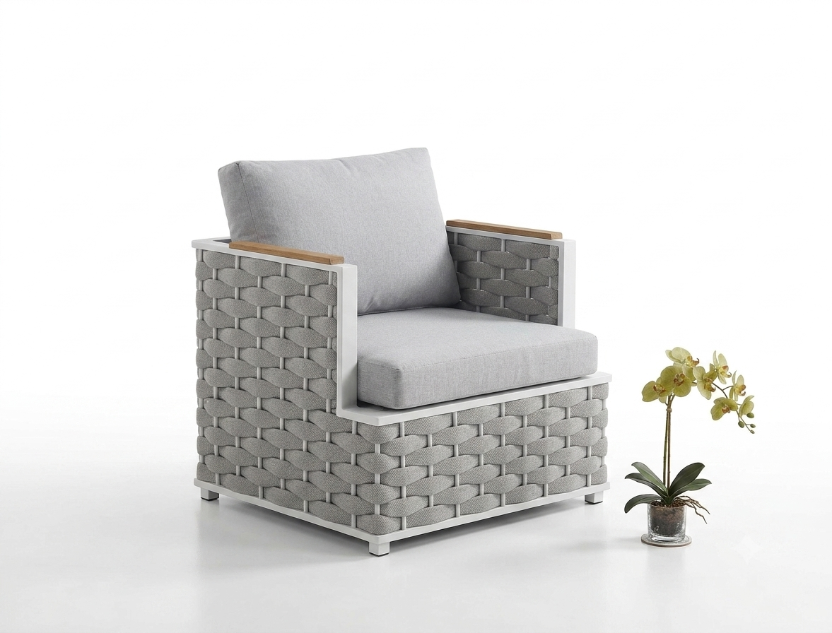 Grey woven outdoor armchair with light wood armrests at The Outdoor Furniture Market