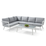 Modern grey sectional outdoor sofa and glass coffee table set at The Outdoor Furniture Market