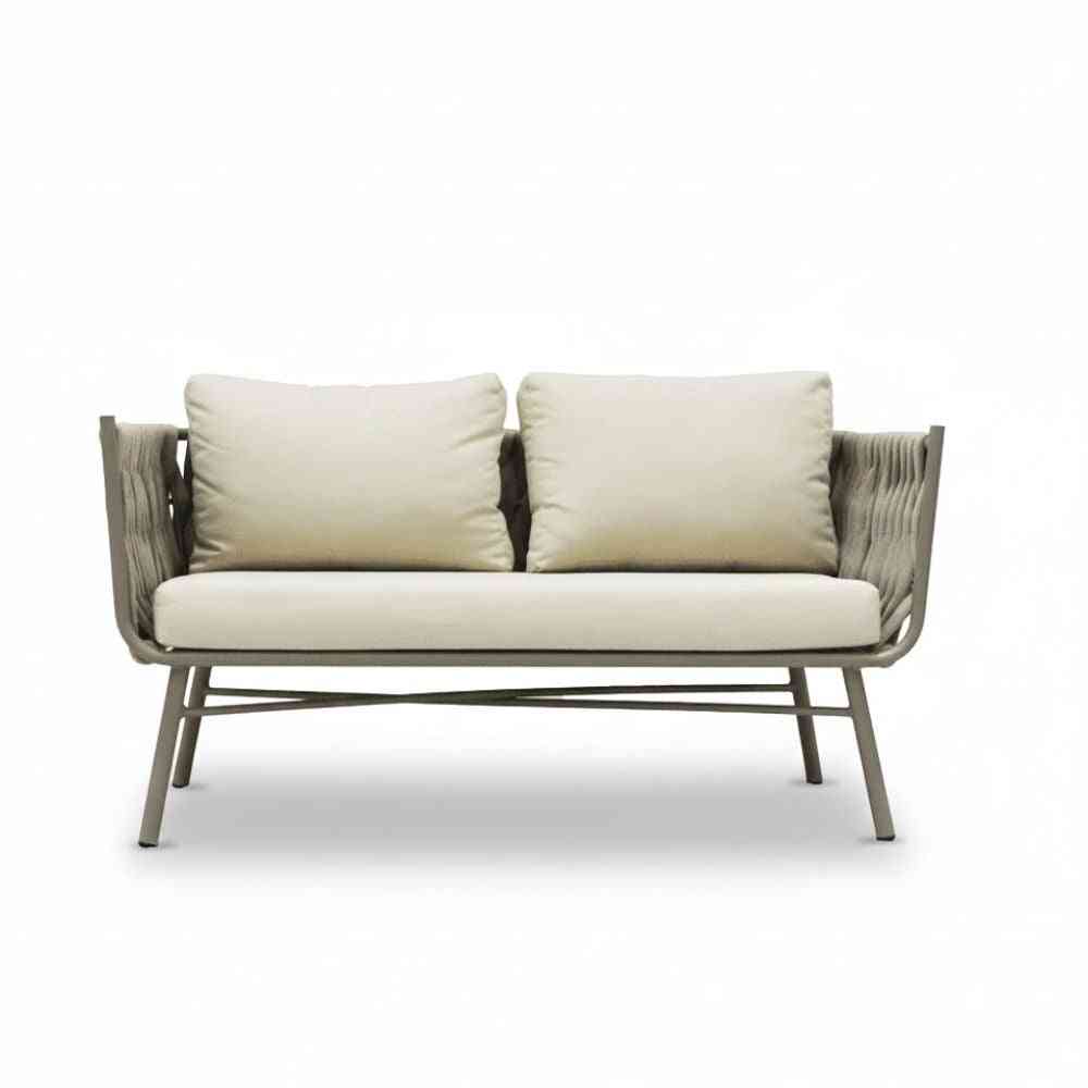 Seven-seater Aura outdoor sofa set with a table, featuring plush cushions and a modern design, perfect for outdoor lounging.