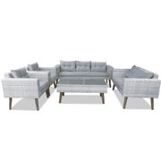 7 seater grey rattan lounge set by with plush grey cushions, ideal for outdoor relaxation and gatherings.