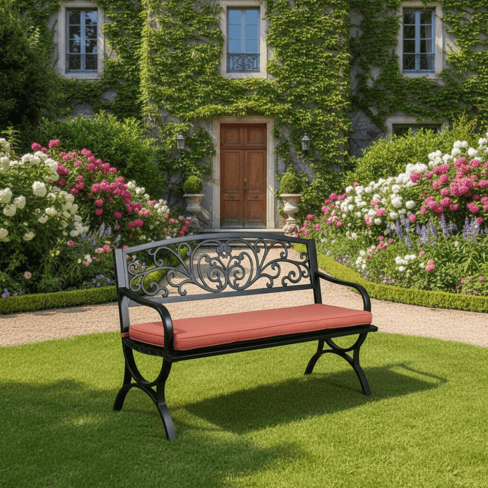 Black steel bench by , featuring a sleek design and sturdy construction for outdoor seating.