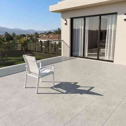 Contemporary white aluminum outdoor dining set with four chairs and a table, suitable for patio or garden outdoor space.