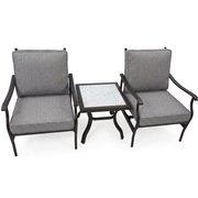 Two grey cushioned outdoor armchairs with a small marble-top side table from The Outdoor Furniture Market