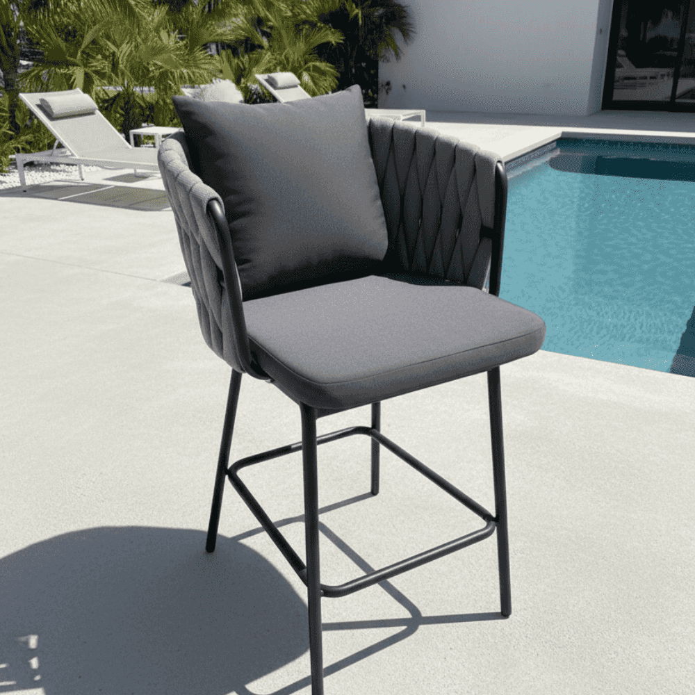 Modern outdoor bar chair by The Outdoor Furniture Market featuring a sleek design with a metal frame and comfortable seating.