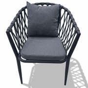 Modern outdoor rope armchair with aluminum frame and weatherproof cushions, ideal for stylish outdoor dining.