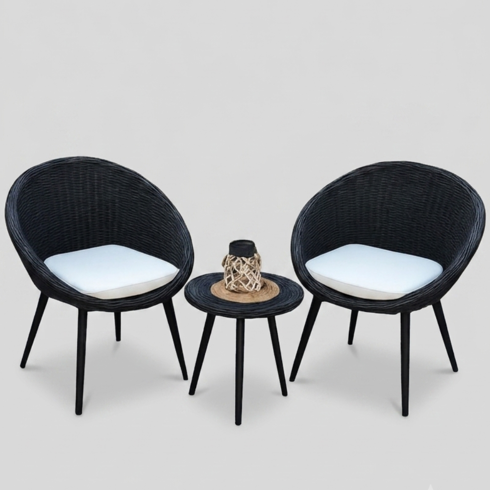 Black wicker outdoor chair set with white cushions and small side table from The Outdoor Furniture Market