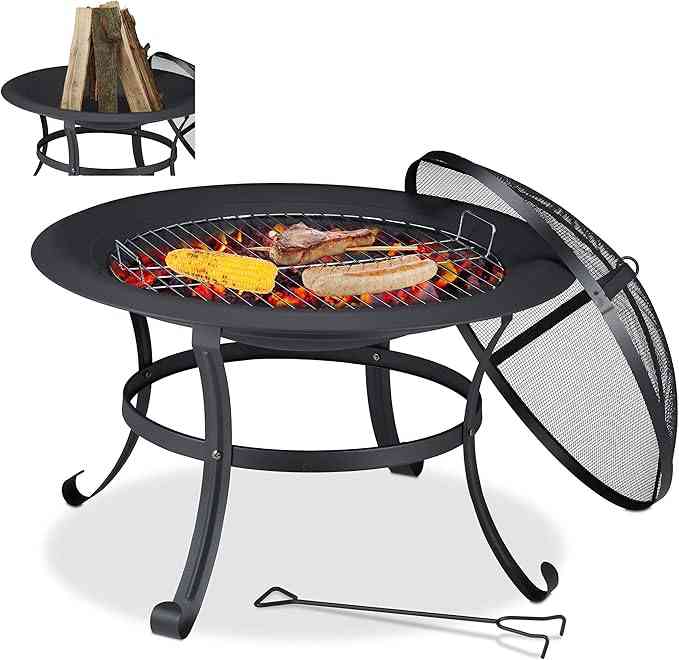 Round outdoor fire pit BBQ grill, 76cm, set up in a garden patio, showcasing the cooking station design.