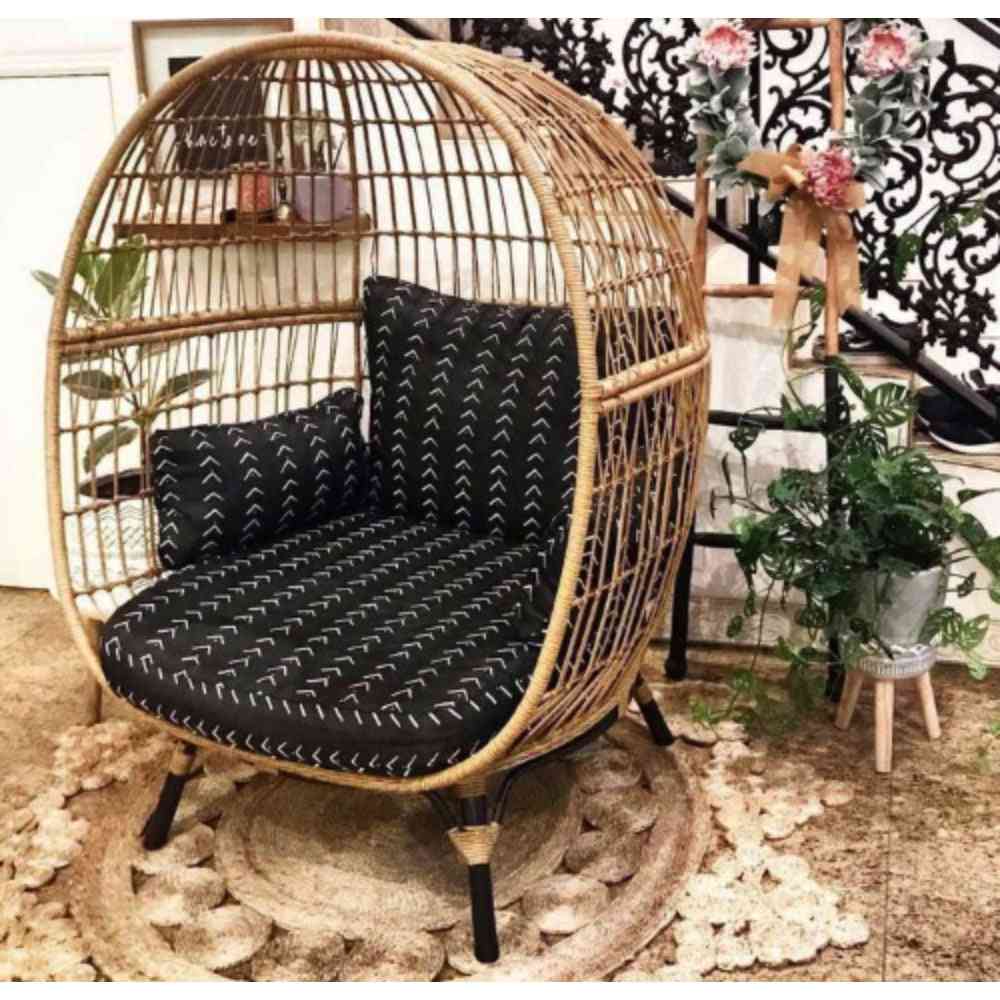 Oversize wicker egg chair by The Outdoor Furniture Market with plush cushions and a rounded, cozy design for outdoor relaxation.