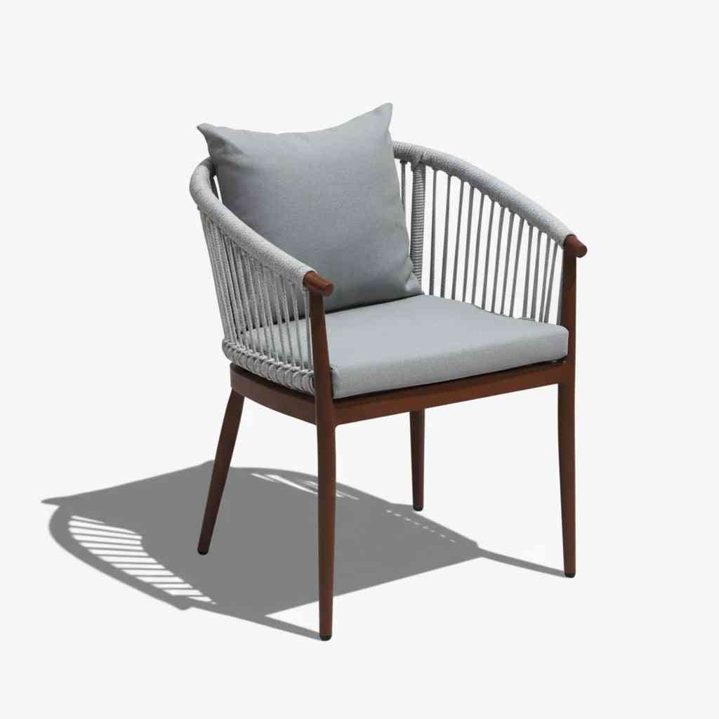 Outdoor dining set with six chairs and table from The Outdoor Furniture Market, featuring elegant design and comfortable seating.