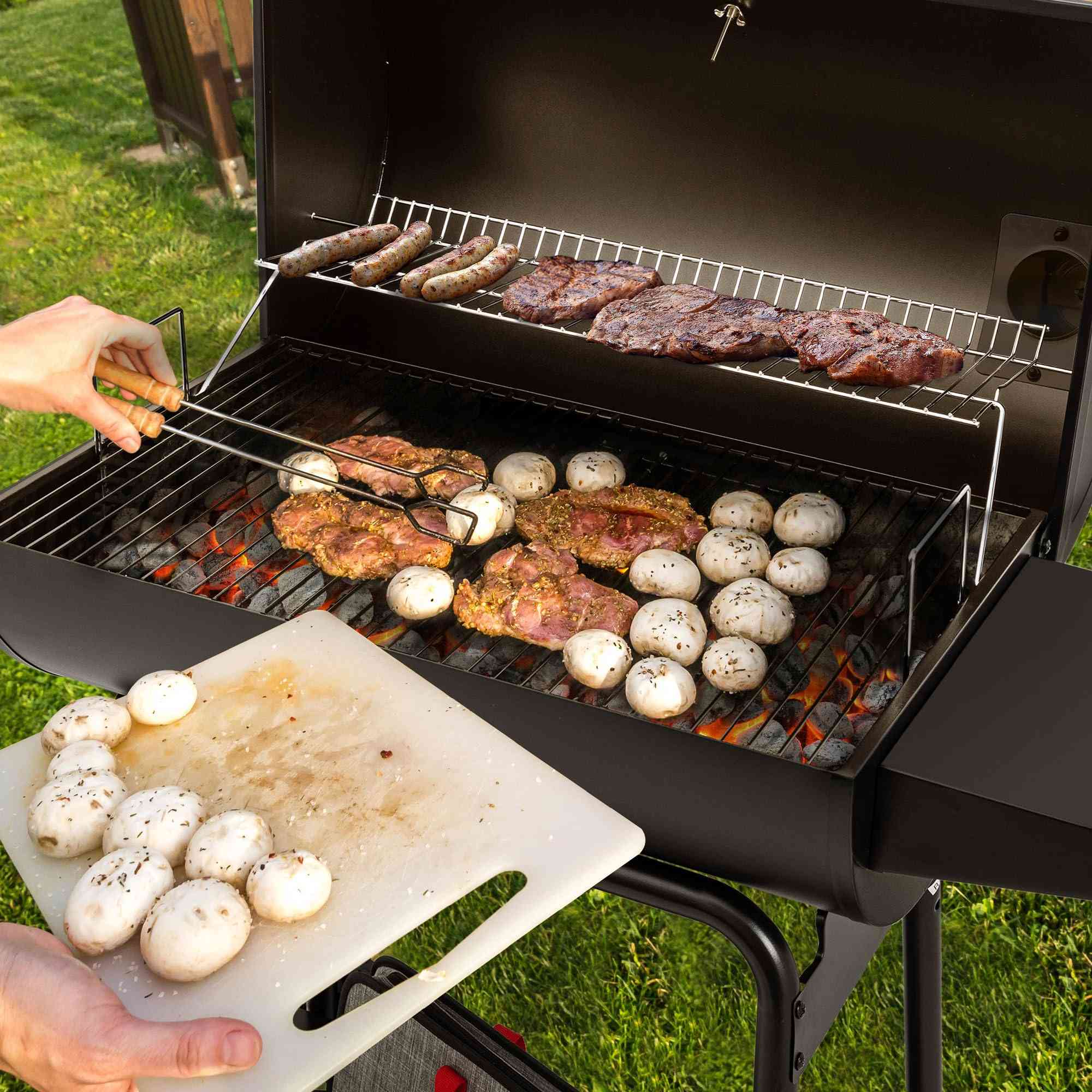 Royal Gourmet CC1830 30-inch barrel charcoal grill with 627 sq.in cooking space, outdoor charcoal grill in black with lid and vents.
