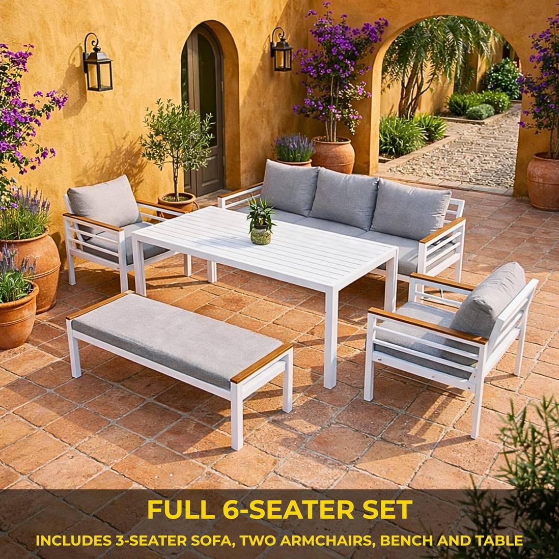 Seven-seater aluminium outdoor sofa and dining set with white frame, grey cushions, and slatted table for garden relaxation.