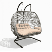 Two-person outdoor patio swing chair with rattan frame and plush cushions for relaxing outdoor lounging.