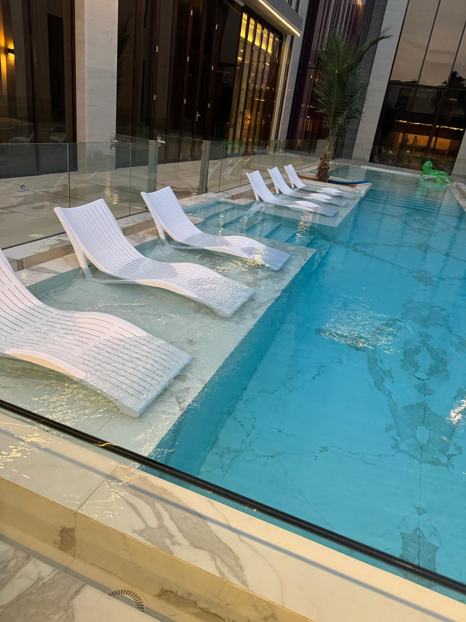 In-Pool Curved Lounger – Luxury Water Sunbed