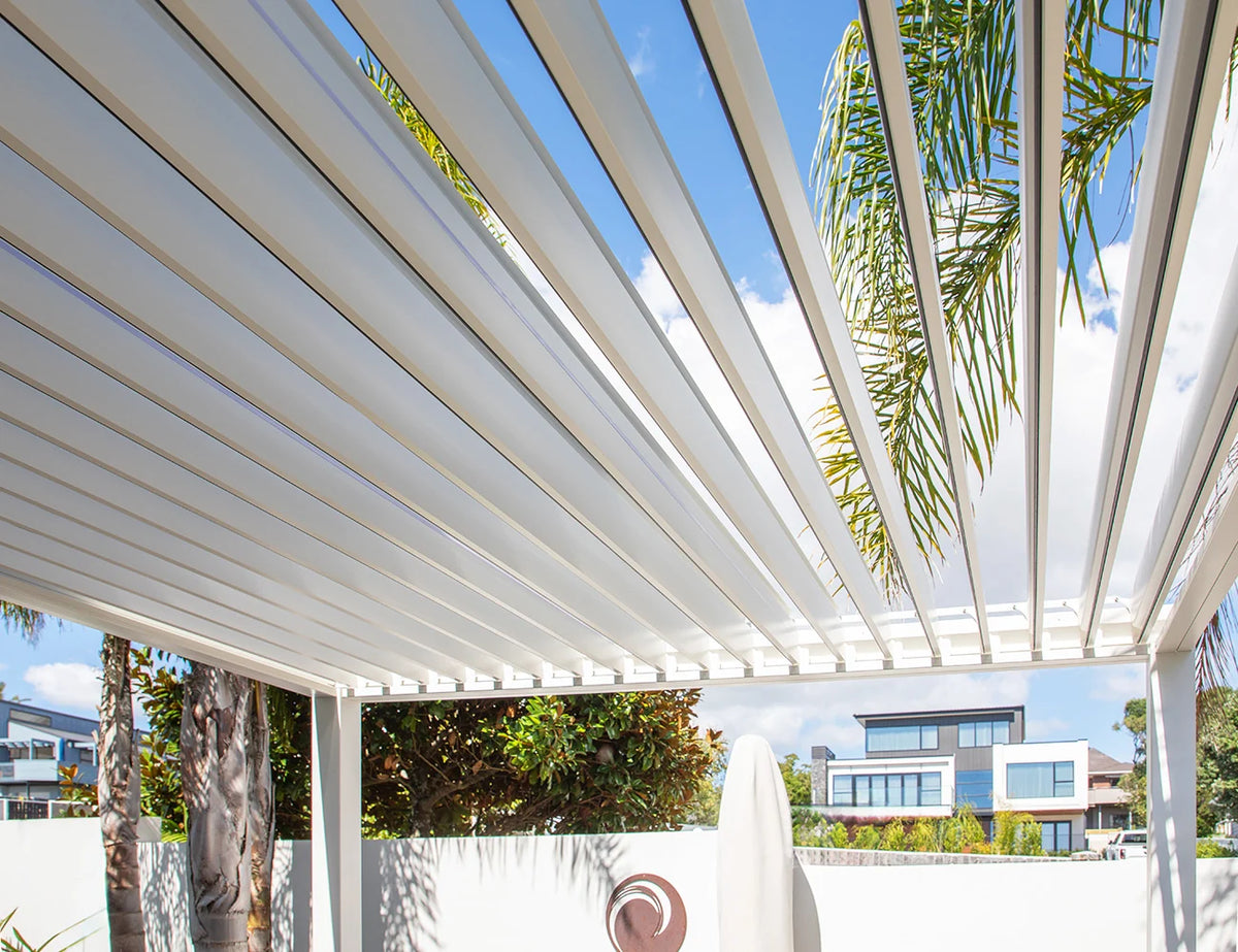 Aluminium gazebo with 3x4m size, wind-resistant roller blinds, featuring louvered roof panels for outdoor shade and shelter.